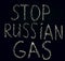 White chalk inscription of words on black board stop Russian gas