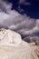 White chalk mountain, quarry against the blue sky. Vertical orientation