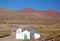 White chapel in red mountain range