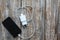 White charger and black smartphone on old wooden background. Information technology horizontal digital photo. Modern layout on