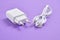 White charger with micro plug on purple background
