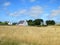 White charming house in field at French