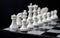 White chess figures on board. White chess set in order for game start.