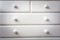 White chest of drawers modern wooden design.background texture minimalism