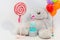 White children`s photozone with huge soft bear and balloons