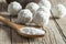White chocolate ball candy with coconut topping and coconuts in wooden spoon