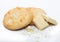 White chocolate biscuit cookies with chocolate blocks and curls on white background