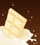 White chocolate falling in milk