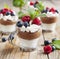 White chocolate and milk chocolate mousse with berries and meringue
