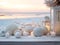 White Christmas ornaments with beach candles on sandy beach against sea or ocean background at warm sunset lights. Happy holidays