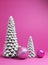 White Christmas trees and pink baubles festive holiday still life
