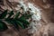 White Chrysanthemum flowers in brown craft paper on a white table. Golden-daisy bouquet on blurred background