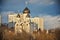 White Church with black domes at sunset