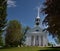 White church on commons in Groton in a bright blue mid spring day