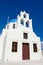 White church, cross, bells Santorini Island Greece