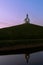 White church on a hill, de Terp reflected in water, the Hague, Netherlands 