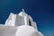 White church on the mountainside of a greek island - AI Generated