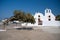 White church and olive tree Santorini, Greece