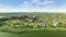 White church and river in Russian village aerial