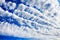 White cirrocumulus clouds blue sky background, fluffy stratocumulus cloud texture, altocumulus cloudy skies, cirrus cloudscape