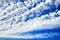 White cirrocumulus clouds blue sky background, fluffy stratocumulus cloud texture, altocumulus cloudy skies, cirrus cloudscape