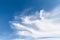 White cirrocumulus clouds in the blue sky. Beautiful sky background