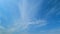 White cirrus or cirrostratus cloudscape on beautiful sunny clear sky. Tropical summer sunlight. Timelapse.