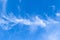 White cirrus cloud high in blue sky