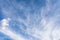 White cirrus clouds against blue sky on morning. Light, airy, white, cumulonimbus clouds in bright blue sky