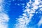 White cirrus clouds blue sky background closeup, fluffy cumulus cloud texture, cloudscape, cloudy weather, cloudiness, ozone layer