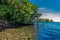 White Cirrus clouds over a lagoon in Samoan fale or hut