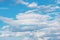 White cirrus, feathery clouds  against spring bright blue cloudy sky  on sunny day in England