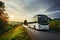 A white city bus meanders through Polands charming countryside on a cloudy day