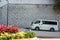 A white classic van parked on the half slope of the street in Hong Kong