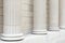 White classical columns and wall background