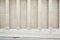 White classical columns and wall background