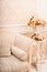White classical sofa close-up and vase with golden branches and