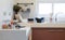 White clean counter in kitchen with utensil