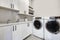 White clean modern laundry room with washer and dryer