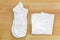 White clean unisex socks and folded underwear panties on wooden