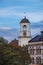 white clock tower in Vyborg city, Russia at sunset in autumn