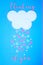 White cloud on blue background with pink and white hearts falling down like snow