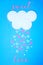 White cloud on blue background with pink and white hearts falling down like snow