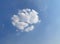 White cloud of circle shape on blue sky. Background image