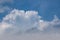 White clouds on the blue sky. Abstract background with clouds on blue sky. In the clear sky high floating clouds