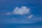 White clouds in blue sky background.