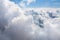White clouds on blue sky background close up, cumulus clouds high in azure skies, beautiful aerial cloudscape view from above