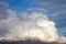 White clouds on the blue sky. Cloud forming a thick uniform gray layer