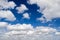 White clouds on blue sky horizontal background
