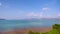 White Clouds move in the Clear blue Sky over sea near Phuket City. Motion Time lapse White clouds swim and change shape.Puffy fluf